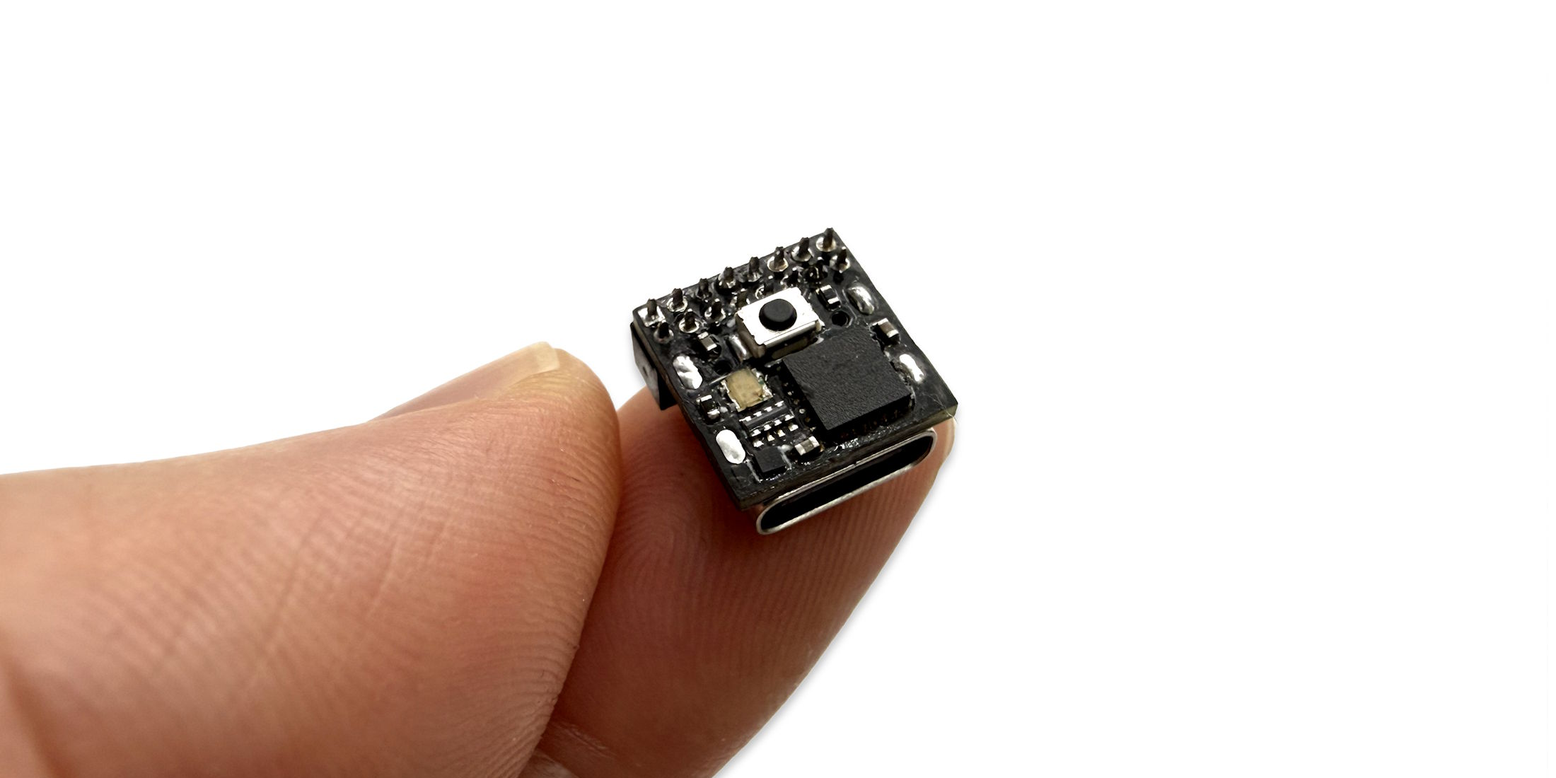 pinch Dev Board held between two fingers